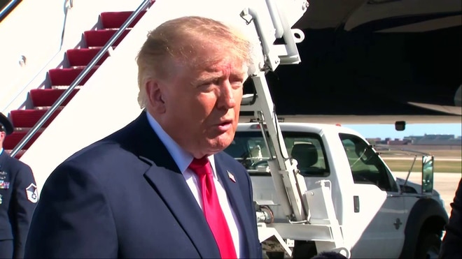 Trump claims midterm momentum in tarmac gaggle, attacks Dem rivals in Michigan and Alaska Senate races