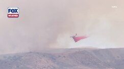 CalFire air tanker fights wildfire on U.S. Military Base