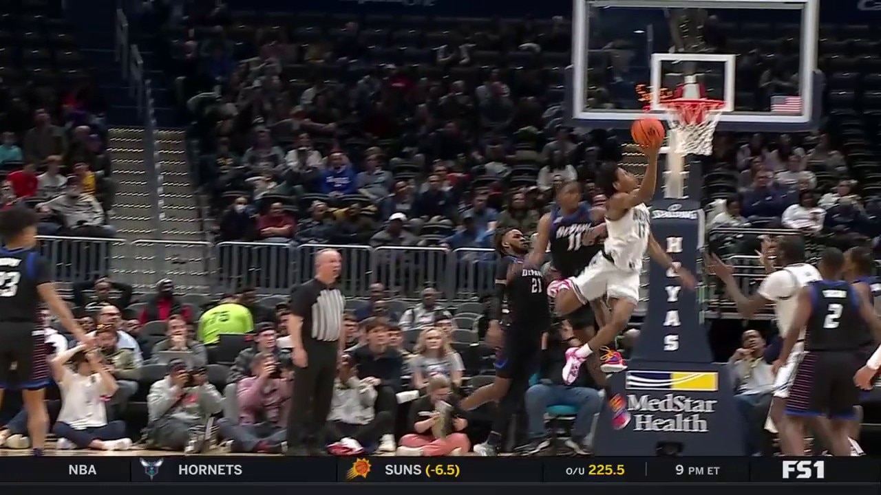 Jordan Riley makes a layup with an acrobatic finish for Georgetown to extend their lead over Depaul