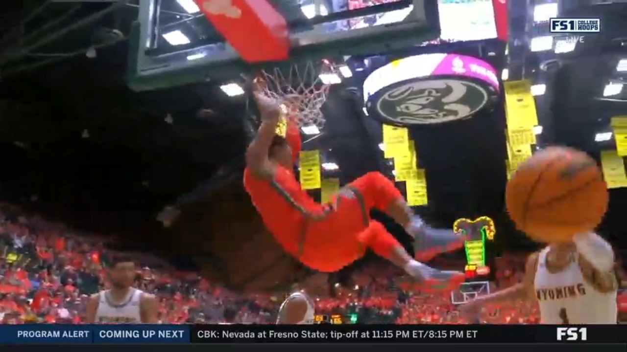 Colorado State's John Tonje finishes with a massive tomahawk slam late in the second half against Wyoming